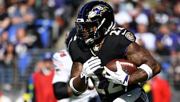 Oct 26, 2025; Baltimore, Maryland, USA; Baltimore Ravens running back Derrick Henry (22) rushes during the second quarter against the Chicago Bears at M&T Bank Stadium. Mandatory Credit: Tommy Gilligan-Imagn Images