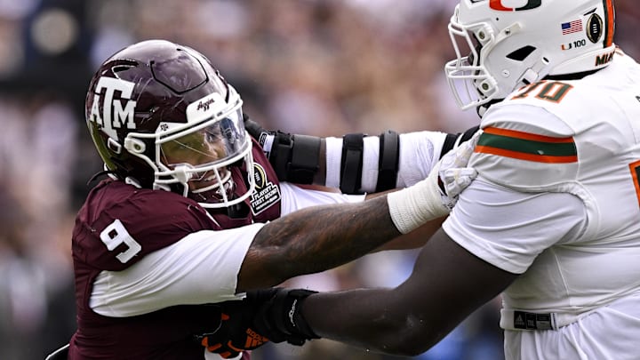 Dec 20, 2025; College Station, TX, USA; Miami Hurricanes offensive lineman Markel Bell (70) blocks Texas A&M Aggies defensive end Cashius Howell (9) during the game between the Aggies and the Hurricanes at Kyle Field. 