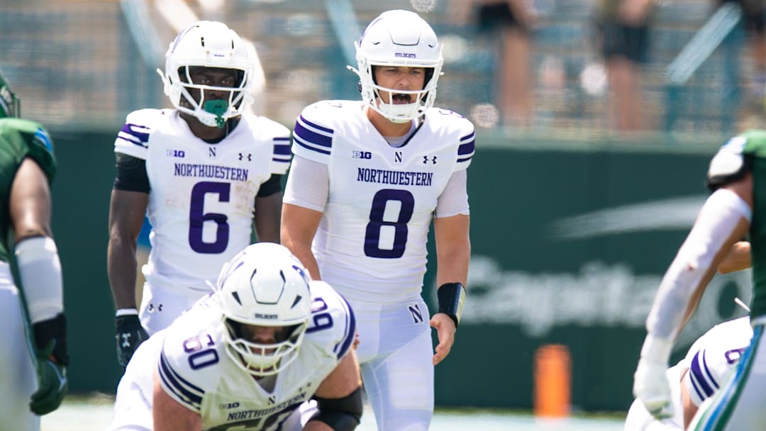 Aug 30, 2025; New Orleans, Louisiana, USA;  Northwestern Wildcats quarterback Preston Stone (8) calls for the ball against Tulane Green Wave during the second half at Yulman Stadium. Mandatory Credit: Stephen Lew-Imagn Images