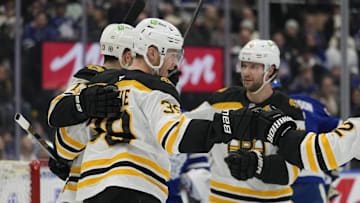 Jan 4, 2025; Toronto, Ontario, CAN; Boston Bruins forward Morgan Geekie (39) get congratulated after scoring against the Toronto Maple Leafs during the second period at Scotiabank Arena. Mandatory Credit: John E. Sokolowski-Imagn Images