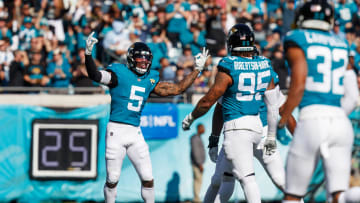 Dec 31, 2023; Jacksonville, Florida, USA; Jacksonville Jaguars safety Andre Cisco (5) celebrates a tackle against the Carolina Panthers during the first quarter at EverBank Stadium. Mandatory Credit: Morgan Tencza-USA TODAY Sports