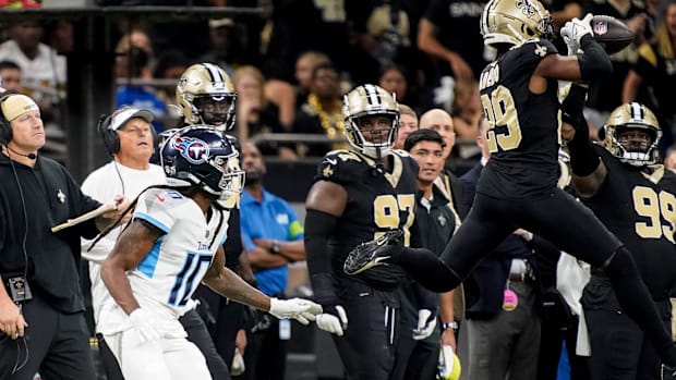 New Orleans Saints cornerback Paulson Adebo (29) intercepts a pass against the Tennessee Titans 