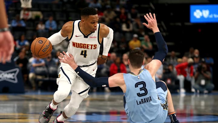 Denver Nuggets guard Russell Westbrook drives to the basket as Memphis Grizzlies forward Jake LaRavia falls during the first half at FedExForum. 