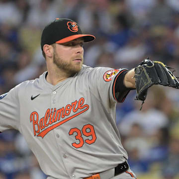 Aug 28, 2024; Los Angeles, California, USA;  Baltimore Orioles starting pitcher Corbin Burnes (39) delivers to the plate in the first inning against the Los Angeles Dodgers at Dodger Stadium.