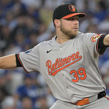 Aug 28, 2024; Los Angeles, California, USA;  Baltimore Orioles starting pitcher Corbin Burnes (39) delivers to the plate in the first inning against the Los Angeles Dodgers at Dodger Stadium.