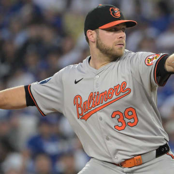 Aug 28, 2024; Los Angeles, California, USA;  Baltimore Orioles starting pitcher Corbin Burnes (39) delivers to the plate in the first inning against the Los Angeles Dodgers at Dodger Stadium.