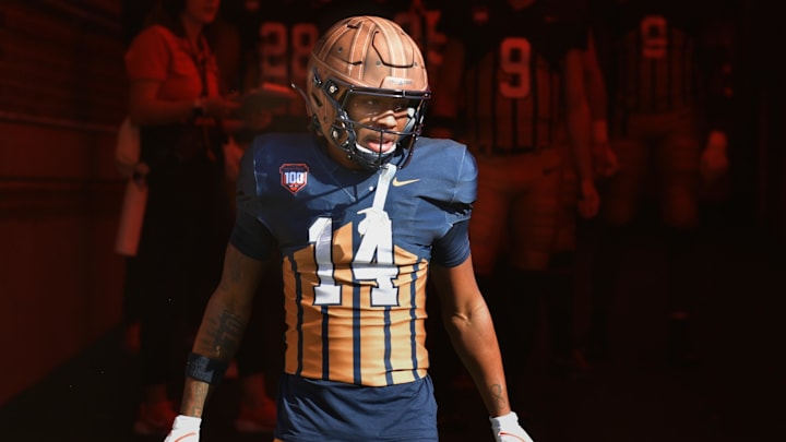 Oct 19, 2024; Champaign, Illinois, USA; Illinois Fighting Illini defensive back Xavier Scott (14) steps into the light on the tunnel before the start of a game with the Michigan Wolverines at Memorial Stadium. Mandatory Credit: Ron Johnson-Imagn Images Oct 19, 2024; Champaign, Illinois, USA; Illinois Fighting Illini defensive back Xavier Scott (14) steps into the light on the tunnel before the start of a game with the Michigan Wolverines at Memorial Stadium. Mandatory Credit: Ron Johnson-Imagn Images