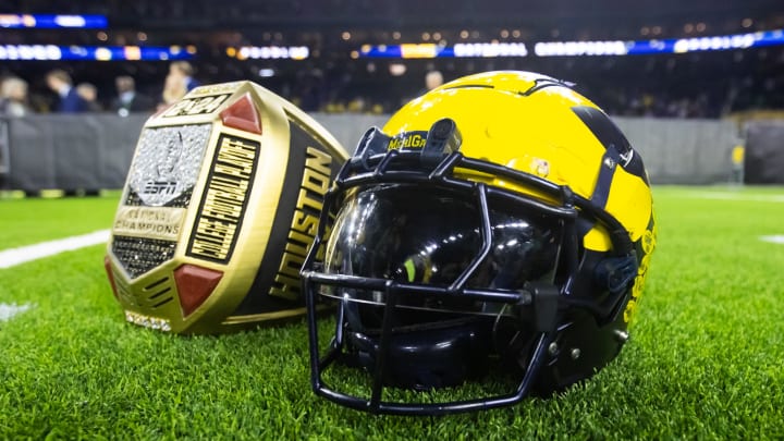 Jan 8, 2024; Houston, TX, USA; Detailed view of a Michigan Wolverines helmet and an oversized championship ring after defeating the Washington Huskies during the 2024 College Football Playoff national championship game at NRG Stadium. Mandatory Credit: Mark J. Rebilas-USA TODAY Sports