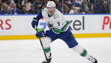 Jan 11, 2025; Toronto, Ontario, CAN; Vancouver Canucks forward J.T. Miller (9) skates against the Toronto Maple Leafs during the second period at Scotiabank Arena. Mandatory Credit: John E. Sokolowski-Imagn Images
