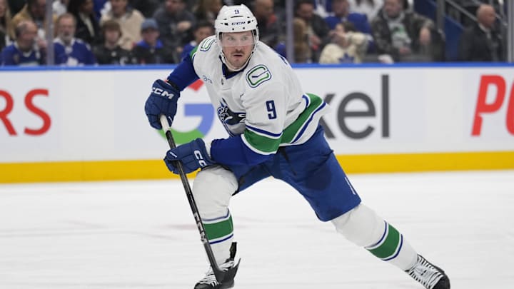 Jan 11, 2025; Toronto, Ontario, CAN; Vancouver Canucks forward J.T. Miller (9) skates against the Toronto Maple Leafs during the second period at Scotiabank Arena. Mandatory Credit: John E. Sokolowski-Imagn Images