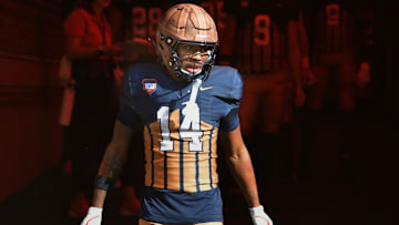 Oct 19, 2024; Champaign, Illinois, USA;  Illinois Fighting Illini defensive back Xavier Scott (14) steps into the light on the tunnel before the start of a game with the Michigan Wolverines at Memorial Stadium. Mandatory Credit: Ron Johnson-Imagn Images