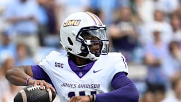 Sep 21, 2024; Chapel Hill, North Carolina, USA; James Madison Dukes quarterback Alonza Barnett III (14) looks to pass in the first quarter at Kenan Memorial Stadium. Mandatory Credit: Bob Donnan-Imagn Images