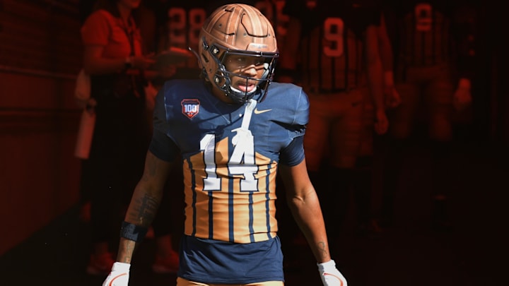 Oct 19, 2024; Champaign, Illinois, USA;  Illinois Fighting Illini defensive back Xavier Scott (14) steps into the light on the tunnel before the start of a game with the Michigan Wolverines at Memorial Stadium. Mandatory Credit: Ron Johnson-Imagn Images