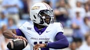 Sep 21, 2024; Chapel Hill, North Carolina, USA; James Madison Dukes quarterback Alonza Barnett III (14) looks to pass in the first quarter at Kenan Memorial Stadium. Mandatory Credit: Bob Donnan-Imagn Images