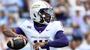 Sep 21, 2024; Chapel Hill, North Carolina, USA; James Madison Dukes quarterback Alonza Barnett III (14) looks to pass in the first quarter at Kenan Memorial Stadium. Mandatory Credit: Bob Donnan-Imagn Images
