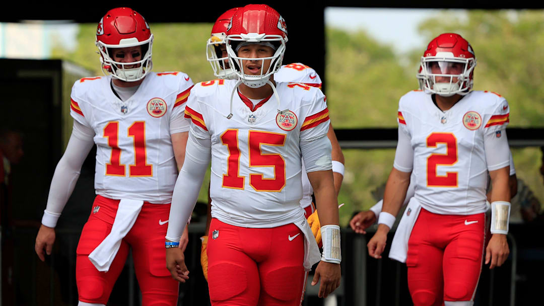 Kansas City Chiefs quarterbacks Patrick Mahomes (15) leads Carson Wentz (11), and Ian Book (2) before a preseason NFL football game at EverBank Stadium.