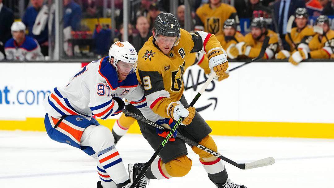 Dec 3, 2024; Las Vegas, Nevada, USA; Edmonton Oilers center Connor McDavid (97) defends against Vegas Golden Knights center Jack Eichel (9) during the second period at T-Mobile Arena. Mandatory Credit: Stephen R. Sylvanie-Imagn Images