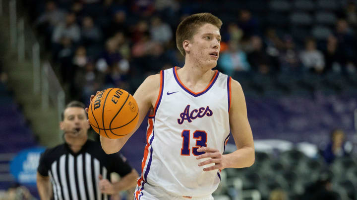 Evansville   s Ben Humrichous (13) dribbles up court as the University of Evansville Purple Aces play the Tennessee Tech Golden Eagles at Ford Center in Evansville, Ind., Wednesday, Dec. 20, 2023. Evansville won, 82-51.