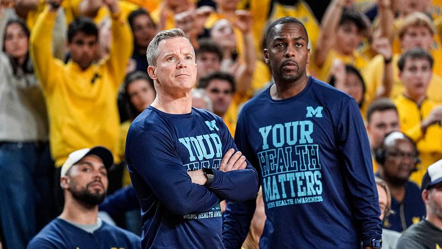 Michigan head coach Dusty May and assistance coach Mike Boynton Jr. watch a free throw against Nebraska.