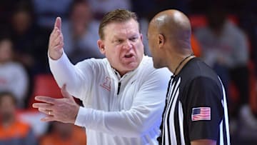 Feb 11, 2025; Champaign, Illinois, USA;  Illinois Fighting Illini head coach Brad Underwood reacts to a call by an official during the second half against the UCLA Bruins at State Farm Center. Mandatory Credit: Ron Johnson-Imagn Images
