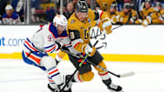 Dec 3, 2024; Las Vegas, Nevada, USA; Edmonton Oilers center Connor McDavid (97) defends against Vegas Golden Knights center Jack Eichel (9) during the second period at T-Mobile Arena. Mandatory Credit: Stephen R. Sylvanie-Imagn Images