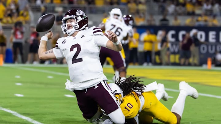 Sep 7, 2024; Tempe, Arizona, USA; Mississippi State Bulldogs quarterback Blake Shapen (2) fumbles the ball as he is tackled by Arizona State Sun Devils defensive lineman Clayton Smith (10) in the first half at Mountain America Stadium. Mandatory Credit: Mark J. Rebilas-Imagn Images