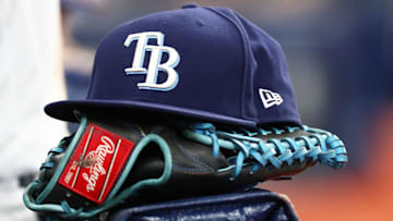 Sep 6, 2019; St. Petersburg, FL, USA; A detail view of a Tampa Bay Rays hat and glove at Tropicana Field. 