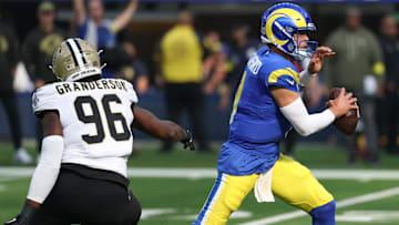 Nov 2, 2025; Inglewood, California, USA; Los Angeles Rams quarterback Matthew Stafford (9) steps up in the pocket as New Orleans Saints defensive end Carl Granderson (96) applies pressure during the first half at SoFi Stadium. Mandatory Credit: Kiyoshi Mio-Imagn Images