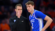 Feb 5, 2025; Syracuse, New York, USA; Duke Blue Devils head coach Jon Scheyer talks with guard Cooper Flagg (2) against the Syracuse Orange during the first half at the JMA Wireless Dome. Mandatory Credit: Rich Barnes-Imagn Images