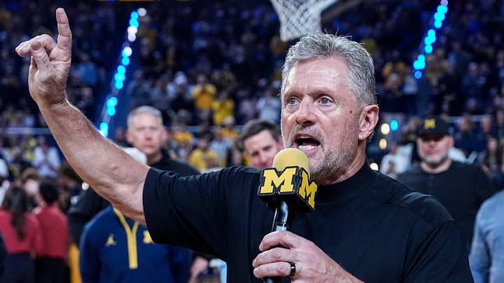 Michigan football head coach Kyle Whittingham speaks as he is being introduced on the floor during the first half between Michigan and USC at Crisler Center in Ann Arbor on Friday, Jan. 2, 2026.