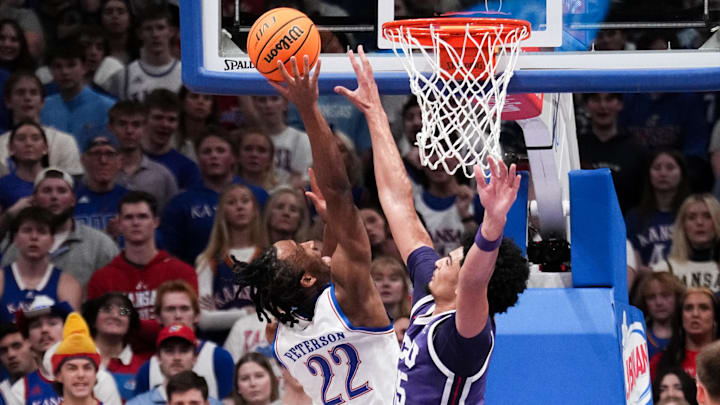 Jan 6, 2026; Lawrence, Kansas, USA; Kansas Jayhawks guard Darryn Peterson (22) shoots as TCU Horned Frogs forward David Punch (15) defends during the first half of the game at Allen Fieldhouse. Mandatory Credit: Denny Medley-Imagn Images