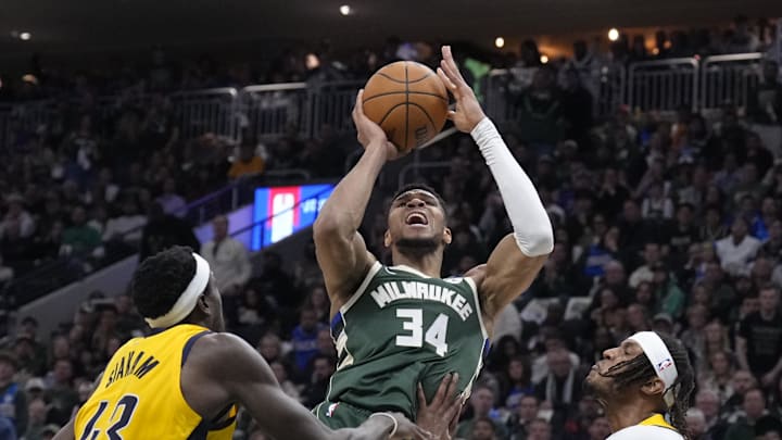 Apr 25, 2025; Milwaukee, Wisconsin, USA; Milwaukee Bucks forward Giannis Antetokounmpo (34) puts up a shot against Indiana Pacers forward Pascal Siakam (43) and Indiana Pacers center Myles Turner (33) in the second half during game three of first round for the 2024 NBA Playoffs at Fiserv Forum. Mandatory Credit: Michael McLoone-Imagn Images Apr 25, 2025; Milwaukee, Wisconsin, USA; Milwaukee Bucks forward Giannis Antetokounmpo (34) puts up a shot against Indiana Pacers forward Pascal Siakam (43) and Indiana Pacers center Myles Turner (33) in the second half during game three of first round for the 2024 NBA Playoffs at Fiserv Forum. Mandatory Credit: Michael McLoone-Imagn Images