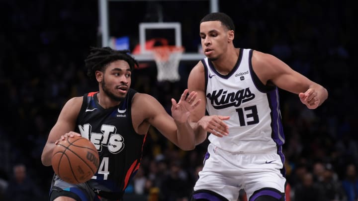 Apr 7, 2024; Brooklyn, New York, USA; Brooklyn Nets guard Cam Thomas (24) dribbles against Sacramento Kings forward Keegan Murray (13) during the second half at Barclays Center. Mandatory Credit: Vincent Carchietta-USA TODAY Sports