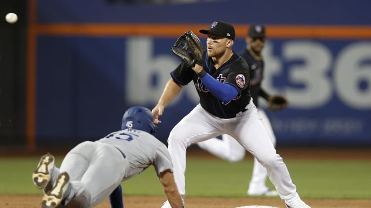 New York Mets infielder Brandon Drury receives a ball.