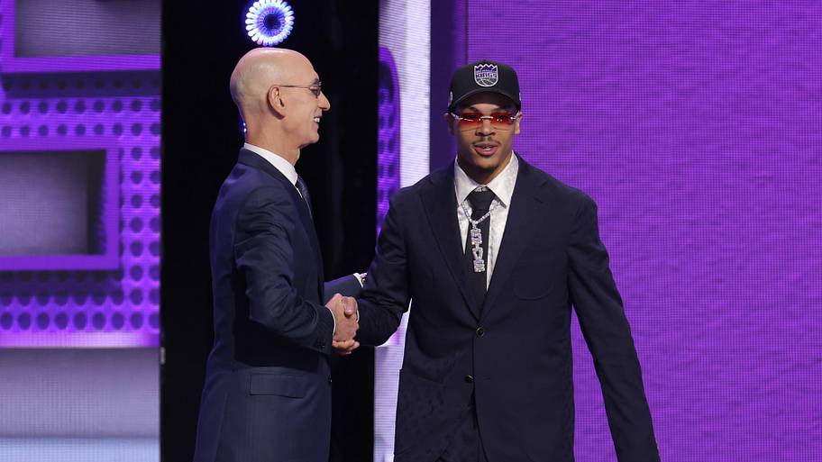 NBA commissioner Adam Silver greets the seventh pick in the 2026 NBA draft, Arkansas guard Darius Acuff Jr.