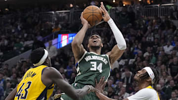 Apr 25, 2025; Milwaukee, Wisconsin, USA; Milwaukee Bucks forward Giannis Antetokounmpo (34) puts up a shot against Indiana Pacers forward Pascal Siakam (43) and Indiana Pacers center Myles Turner (33) in the second half during game three of first round for the 2024 NBA Playoffs at Fiserv Forum. Mandatory Credit: Michael McLoone-Imagn Images