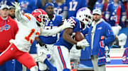 Nov 17, 2024; Orchard Park, New York, USA; Buffalo Bills wide receiver Amari Cooper (18) makes a catch in front of Kansas City Chiefs safety Nazeeh Johnson (13) in the first quarter at Highmark Stadium. Mandatory Credit: Mark Konezny-Imagn Images