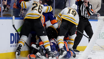 Nov 4, 2025; Elmont, New York, USA; New York Islanders and Boston Bruins players fight after a hit on New York Islanders defenseman Matthew Schaefer (48) by Boston Bruins defenseman Nikita Zadorov (91) during the second period at UBS Arena. Mandatory Credit: Brad Penner-Imagn Images