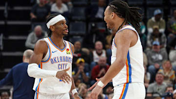 Mar 5, 2025; Memphis, Tennessee, USA; Oklahoma City Thunder guard Shai Gilgeous-Alexander (2) reacts with forward Jaylin Williams (6) during the fourth quarter against the Memphis Grizzlies at FedExForum. Mandatory Credit: Petre Thomas-Imagn Images