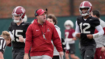Mar 5, 2025; Tuscaloosa, AL, USA; Quarterbacks coach Nick Seridan walks between quarterbacks Ty Simpson (15) and Keelon Russell (12)during Spring Practice for the Crimson Tide.