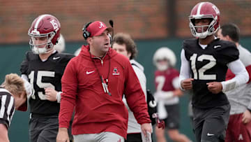 Mar 5, 2025; Tuscaloosa, AL, USA; Quarterbacks coach Nick Seridan walks between quarterbacks Ty Simpson (15) and Keelon Russell (12)during Spring Practice for the Crimson Tide.