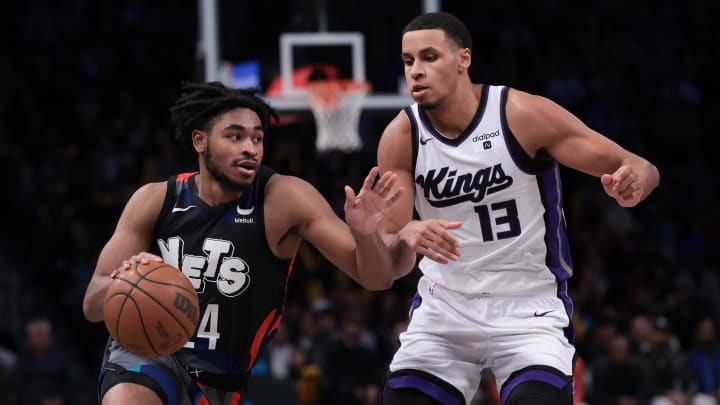 Apr 7, 2024; Brooklyn, New York, USA; Brooklyn Nets guard Cam Thomas (24) dribbles against Sacramento Kings forward Keegan Murray (13) during the second half at Barclays Center. Mandatory Credit: Vincent Carchietta-USA TODAY Sports