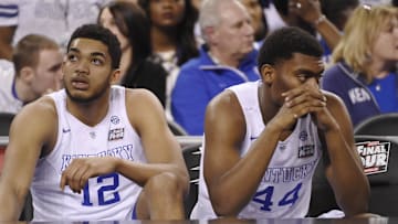 Apr 4, 2015; Indianapolis, IN, USA; Kentucky Wildcats forward Karl-Anthony Towns (12) and Dakari Johnson (44) sit on the bench following their loss to the Wisconsin Badgers 71-64 in the 2015 NCAA Men's Division I Championship semi-final game at Lucas Oil Stadium. Mandatory Credit: Robert Deutsch-Imagn Images