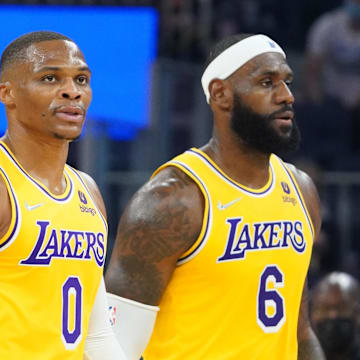 October 8, 2021; San Francisco, California, USA; Los Angeles Lakers guard Russell Westbrook (0) and forward LeBron James (6) walk to the bench during the first quarter against the Golden State Warriors at Chase Center. 