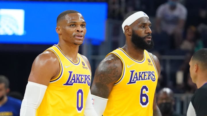 October 8, 2021; San Francisco, California, USA; Los Angeles Lakers guard Russell Westbrook (0) and forward LeBron James (6) walk to the bench during the first quarter against the Golden State Warriors at Chase Center. 