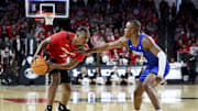 Mar 5, 2023; Cincinnati, Ohio, USA;  Cincinnati Bearcats guard Landers Nolley II (2) controls the ball against Southern Methodist Mustangs guard Zach Nutall (10) in the first half at Fifth Third Arena. Mandatory Credit: Aaron Doster-Imagn Images
