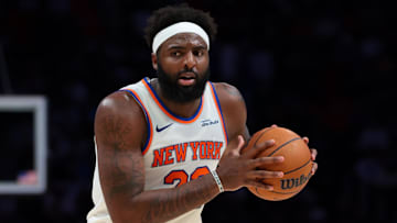 Nov 17, 2025; Miami, Florida, USA; New York Knicks center Mitchell Robinson (23) protects the basketball against the Miami Heat during the third quarter at Kaseya Center. Mandatory Credit: Sam Navarro-Imagn Images