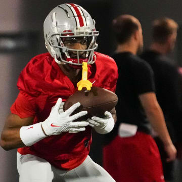 Mar 7, 2024; Columbus, OH, USA; Ohio State Buckeyes wide receiver Carnell Tate (17) returns a punt during spring football practice at the Woody Hayes Athletic Center.