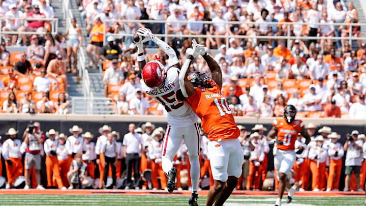 Arkansas' Jaheim Singletary (15) intercepts a pass intended for Oklahoma State's Rashod Owens (10) in the first half of the college football game between the Oklahoma State Cowboys and the Arkansas Razorbacks at Boone Pickens Stadium in Stillwater, Okla.,, Saturday, Sept., 7, 2024.