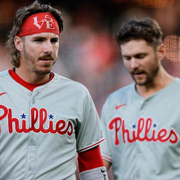May 20, 2025; Denver, Colorado, USA; Philadelphia Phillies second baseman Bryson Stott (5) and shortstop Trea Turner (7) in the fourth inning against the Colorado Rockies at Coors Field
